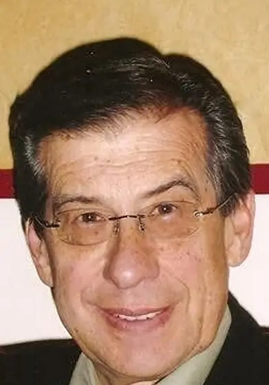 Portrait photograph of author Victor Moss.